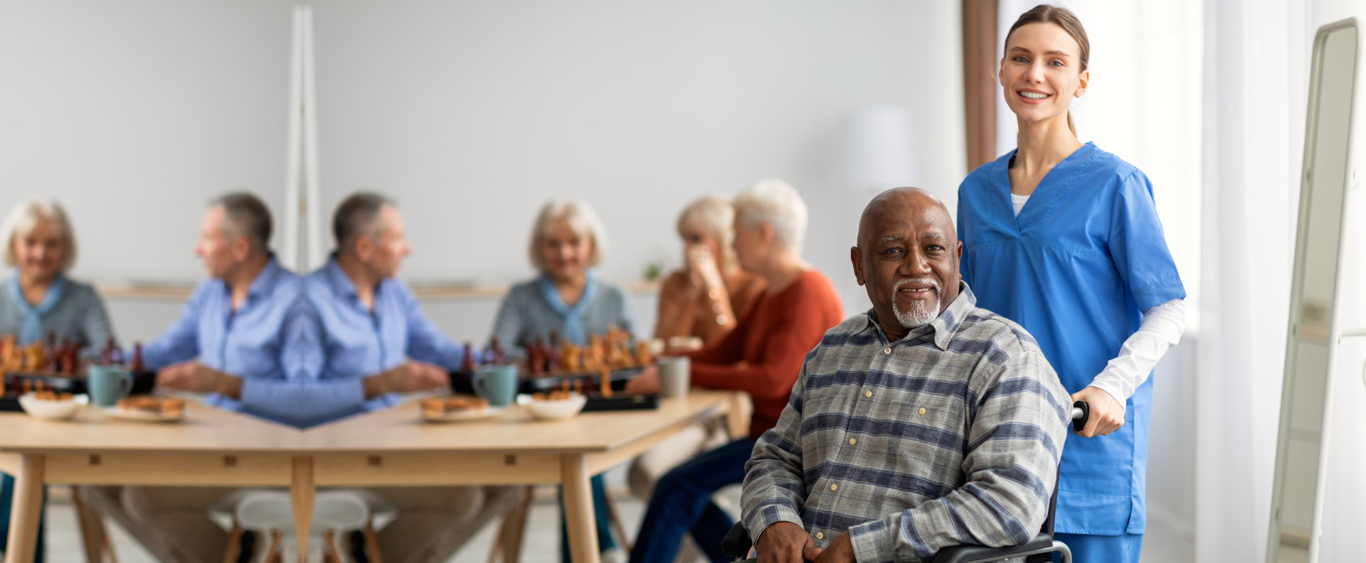 Caretaker helping an elderly man